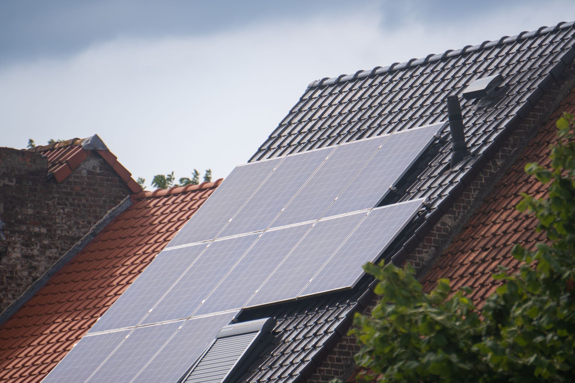 Rooftop solar panels installed under a clear sky